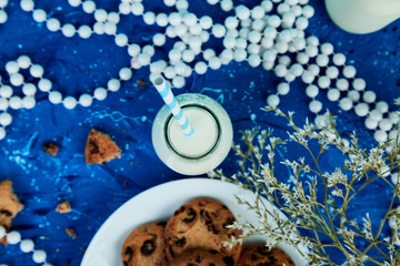 Cookie chocolate with a milk bottles.