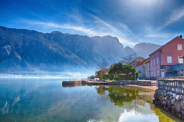 Beautiful natural landscape in sunny weather. Mountains, the sea and a small fisherman's house on the shore