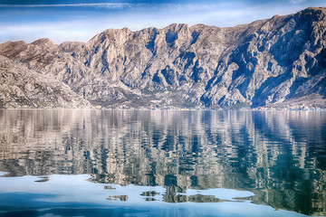 Beautiful natural landscape in sunny weather. The mountains are reflected in the sea
