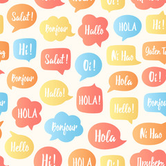 Speech bubbles seamless pattern. Vector background of color bubbles with word hello in different languages: hi, hallo, hola etc. Communication people concept. Vector illustration for language center © Anastasiia23