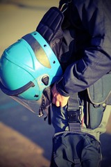 blue helmet of a policeman in riot gear during the uprising with photo effect
