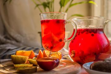 Vegetarian breakfast - fruits with pastries and a drink of cranberries and berries on a rustic background, in the morning
