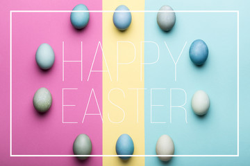 Happy Easter pastel coloured background. Hand painted Easter eggs abstract minimal concept.