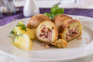 baked bacon dumplings with tomatoes