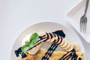 Banana cold crepe (Japanese Desserts), Crepe with banana and chocolate and vanilla ice-cream.