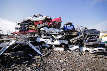 Pile of used old cars at a scrapheap junkyard - obrazy, fototapety, plakaty