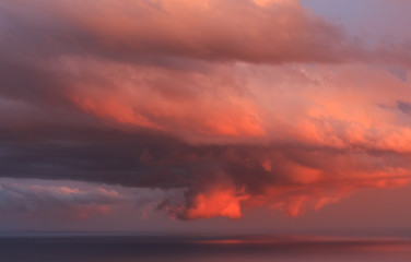 Fototapeta premium Big red clouds at sunset. Environmental phenomena concept