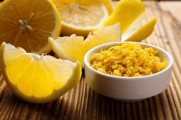 Lemon and juice on a wooden background