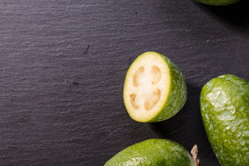 fresh fruits of the feijoa on the rustic background