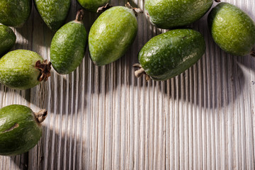 fresh fruits of the feijoa on the rustic background
