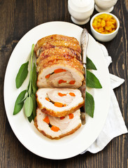 Fried pork loin stuffed with carrots and garlic. Festive dish.