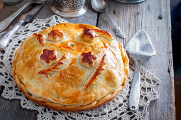 Festive national pie from chicken, pancakes, rice, mushrooms for the wedding table(kurnik, kournik ), Russian rustic style, horizontal © Анна Журавлева
