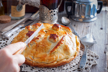 Festive national pie from chicken, pancakes, rice, mushrooms for the wedding table(kurnik, kournik ), Russian rustic style, horizontal © Анна Журавлева