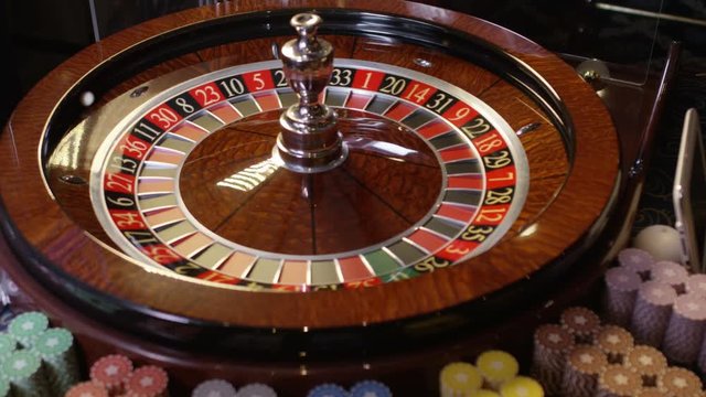 Casino roulette in motion, the spinning wheel ball. Shot on RED EPIC DRAGON Cinema Camera in slow motion.