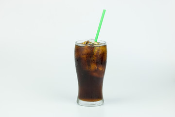 cold cola with ice in a glass on white background