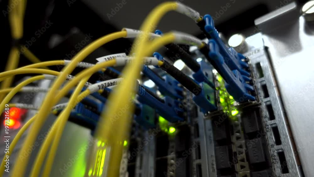 Poster fiber optical connector interface. rack mounted servers in a server room, server rack audio cable. s