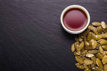 pumpkin seed oil on a rustic background
