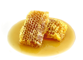 Fresh honey with honeycomb on a white background