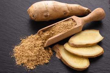 Ginger root on a dark stone background