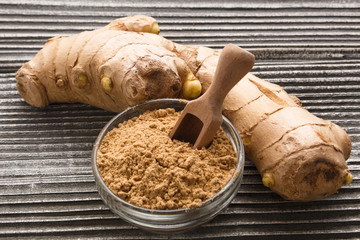 Ginger root on a gray wooden background