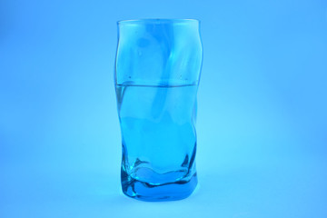 Glass of pure water on a blue background stock photo images. Glass of clean water stock images. Blue glass of water on a blue background stock photo