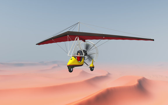 Ultraleichtflugzeug über einer Sandwüste