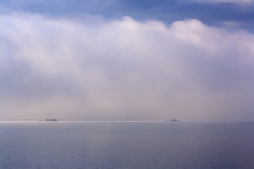 Canoes on the foggy lake