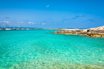 Tourists in Illetes beach Formentera island, Mediterranean sea, Spain