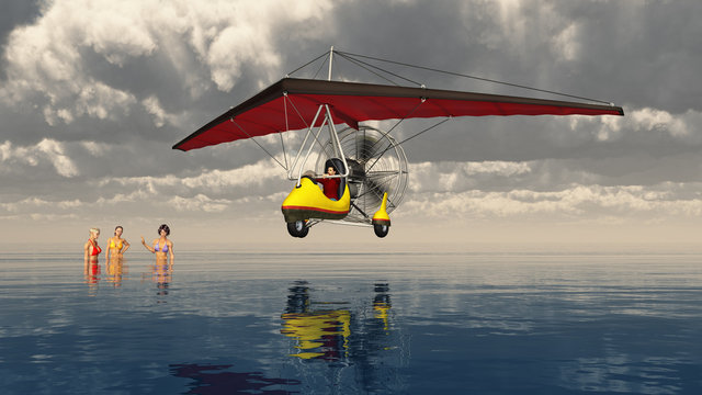 Ultraleichtflugzeug über dem Meer mit badenden Frauen