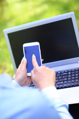 A young attractive woman studying outside