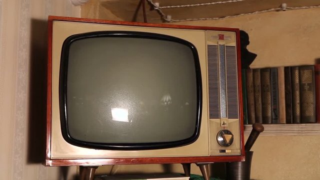 Old TV, retro TV in an old interior. Authentic Old TV