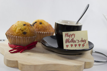 breakfast for mother's day, cup, muffin, and birthday card with red writing