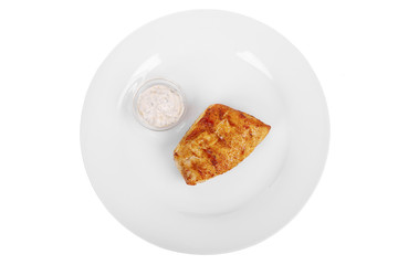 Steak from chicken, pork, grilled meat, barbecue, on a plate isolated white background. Tartar, sour cream, mayonnaise, white sauce. Juicy fillet For the menu in the restaurant, bar. View from above
