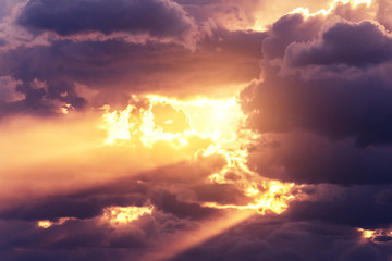 Sun through the clouds during sunset