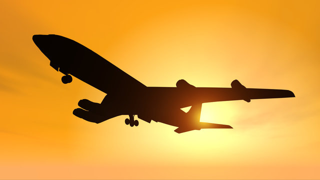 Silhouette eines Verkehrsflugzeuges vor einem gelben Himmel