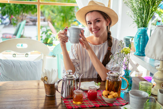 Village Girl Drinking Tea.