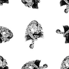 Seamless pattern of hand drawn sketch style leopards isolated on white background. Vector illustration.