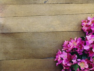 space copy wood background with purple flowers bouquet