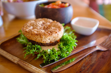 Vegetable mushroom burger with salad and topping.