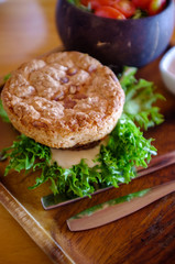 Vegetable mushroom burger with salad and topping.