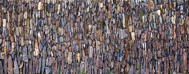 Fototapeta premium Panoramic vertical stones wall