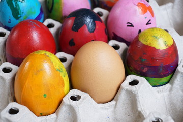 Fototapeta na wymiar Colorful fancy easter eggs in tray