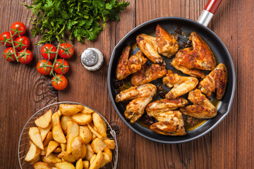 Baked wings, served with dip or baked potatoes.