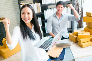 business co worker man and woman fighting happy to online shopping working with laptop and box package in home office, clear tone light process style