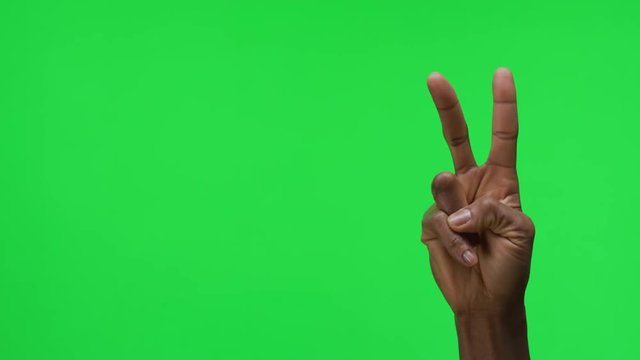 Female Hand Peace Gesture on Green Screen Background
