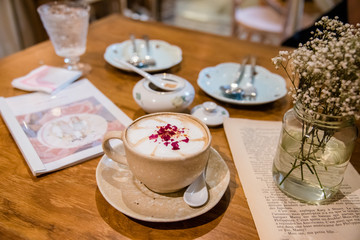 morning coffee topping with flower and latte art.