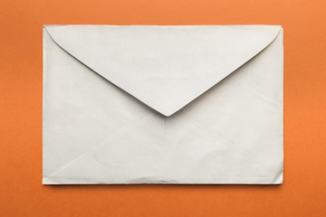 Old envelope open, isolated on orange background