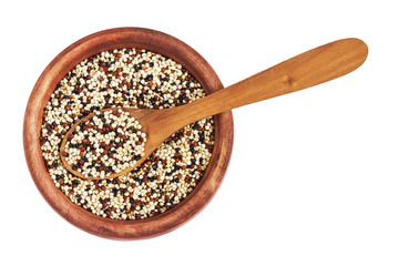 Mixed raw quinoa (Chenopodium quinoa). Red, black and white seeds in wooden bowl isolated on white background