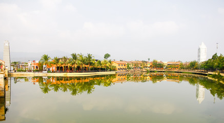 Fototapeta premium Village beside River, it is Thai local community life. a group of houses and associated buildings, smaller town.