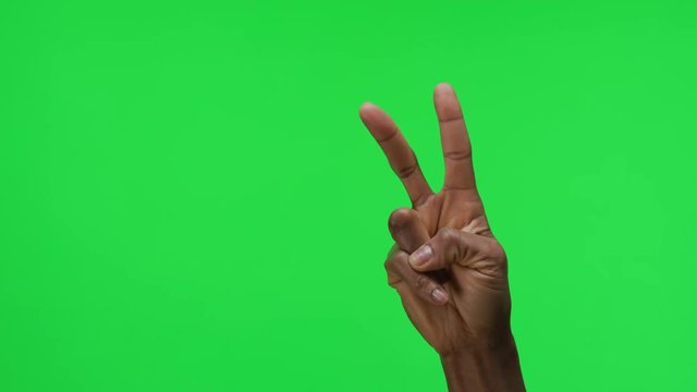 Female Hand Peace Gesture on Green Screen Background